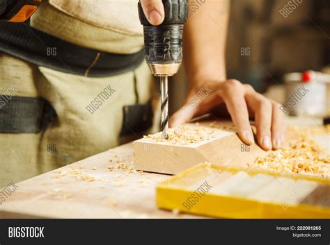 wood boring drill mans image photo  trial bigstock