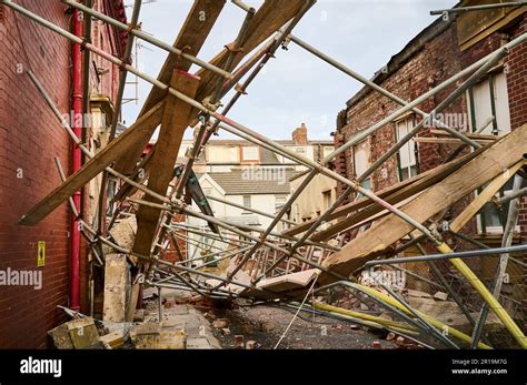 building scaffold collapsed  alleyway stock photo alamy