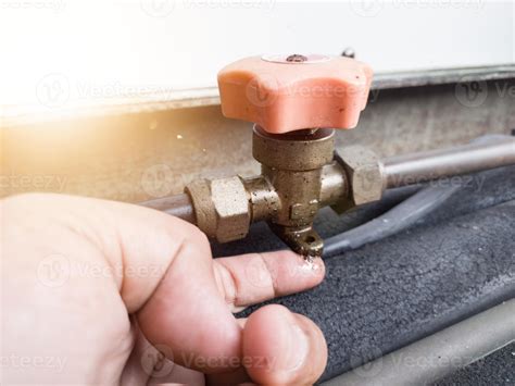 Checking for refrigerant gas leaks in outdoor HVAC systems. check oil