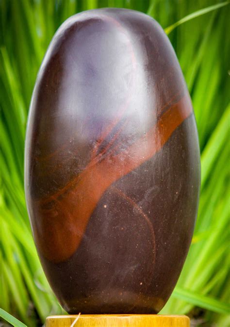 Deep Red Colored Narmada Shiva Lingam Stone with Lines Representing ...