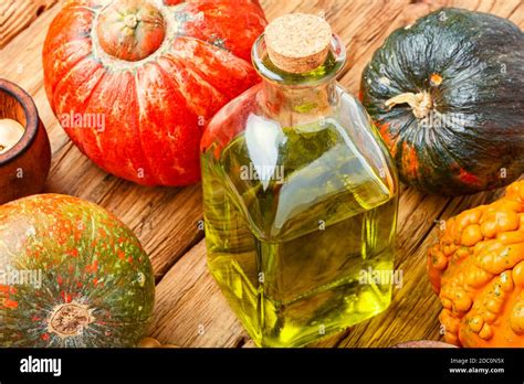 Pumpkin oil and raw pumpkin.Bowl of pumpkin seed oil Stock Photo - Alamy