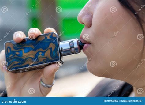 Smoking a Cigarette Smoke. Woman Smoking an E-cigarette. Glamorous ...