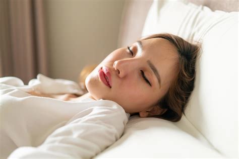 Portrait beautiful Asian woman sleeping on bed with white pillow