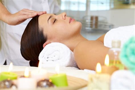 Young woman receiving facial massage | Free Photo
