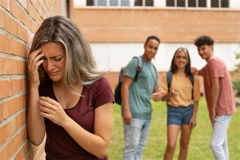 Free Photo | Colleagues bullying girl at school medium shot