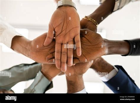 African Business Team Hands. Community Spirit Concept Stock Photo - Alamy