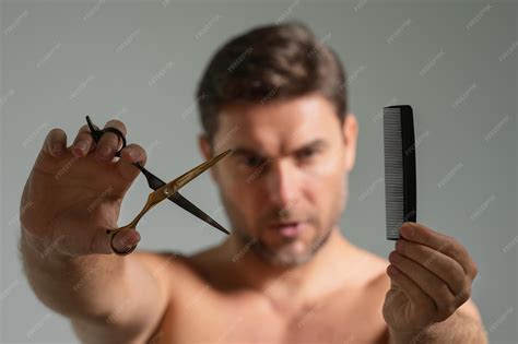 Premium Photo | Man with scissors man cut hair with hairdressing ...