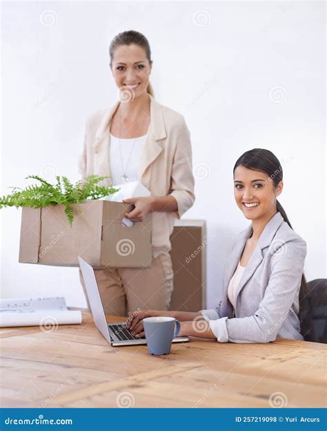 Theyre Happy with Their New Office Space. Two Young Female Colleagues Moving into Their New