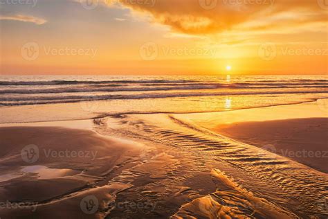 Atlantic ocean sunset with surging waves at Fonte da Telha beach