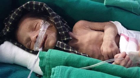 Newborn girl found alive in shallow grave in India - BBC News