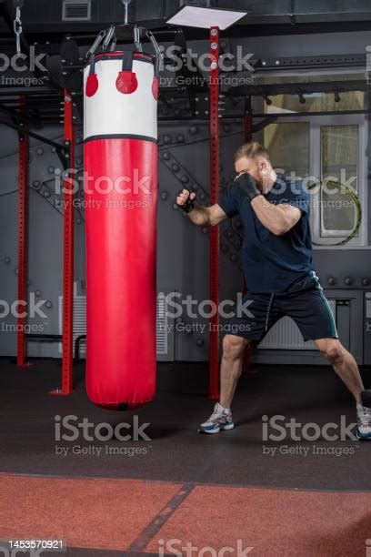 Young And Strong Mixed Martial Arts Fighter Stands In Defensive Stance ...