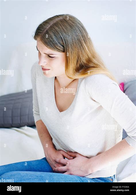 WOMAN WITH ABDOMINAL PAIN Stock Photo - Alamy