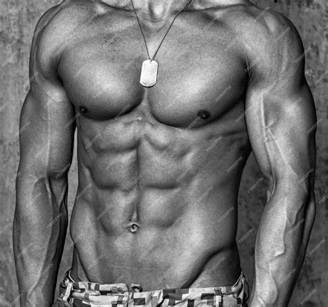 Free Photo | Muscular male body over the wall.