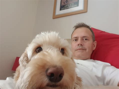 Buddy and me chilling out on my bed watching tv. He is my partners dog