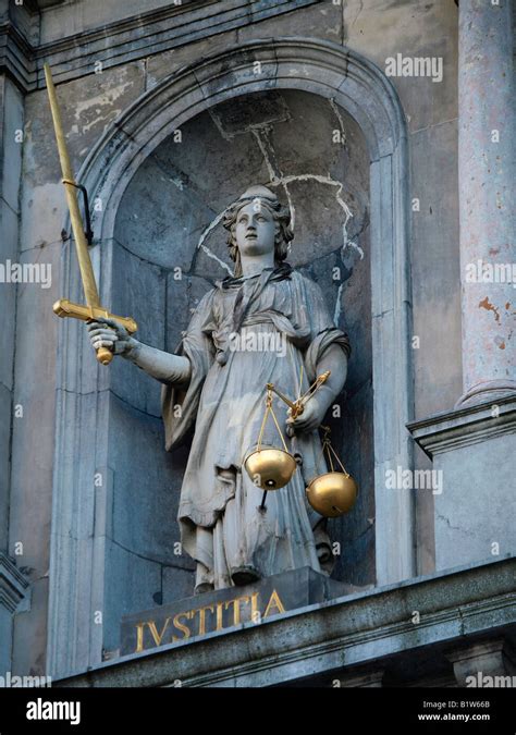 Lady Justice statue iustitia with golden scales of justice and sword Antwerp Flanders Belgium ...