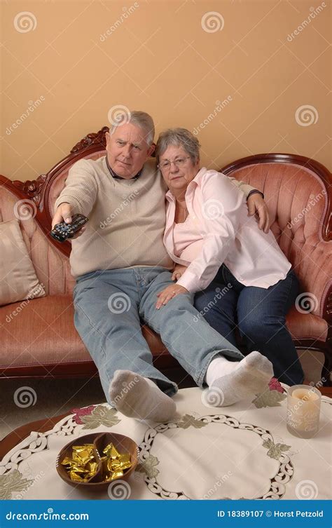 seniors watching tv stock image image  sixties interior