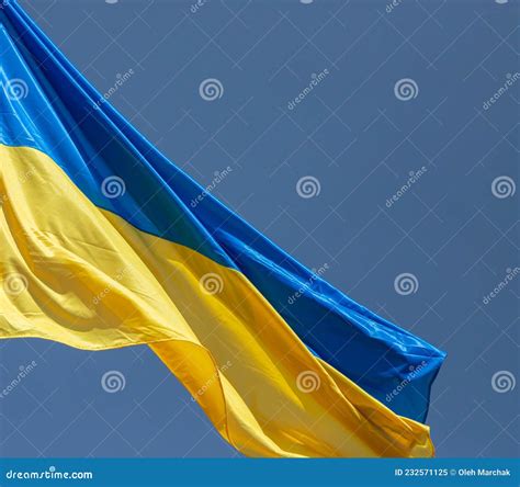 Ukraine Flag Waving on the Wind Against the Blue Sky Stock Image ...