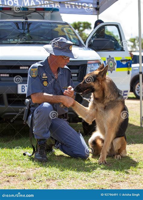 South African Police Service Officer with K-9 Dog Editorial Photo