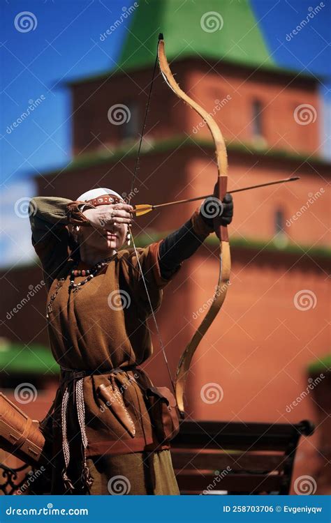 Medieval Archery Tournament. a Woman Shoots an Arrow in the Medieval Castle Yard Editorial Photo ...