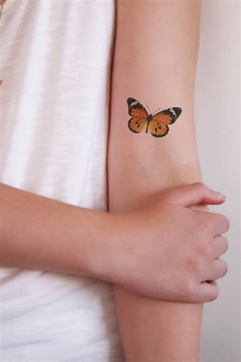 Orange Butterfly Tattoo • Arm Tattoo Sites