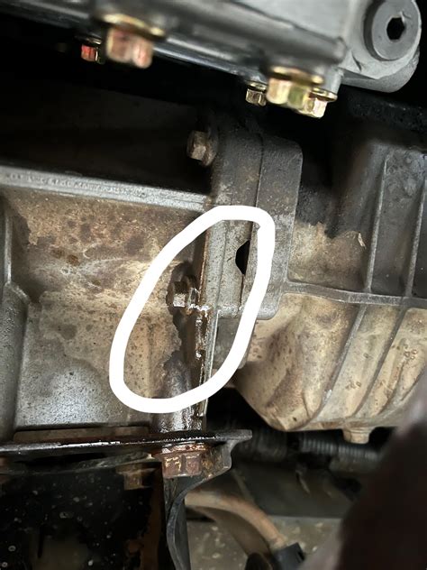 Leak between transfer case and transmission (weird noon shaped hole