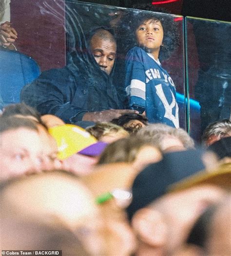 Kanye West and son Saint, seven, take in the Genoa vs AC Milan soccer ...