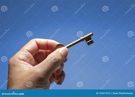 Hand Holding the Key To Success Stock Photo - Image of improvement ...