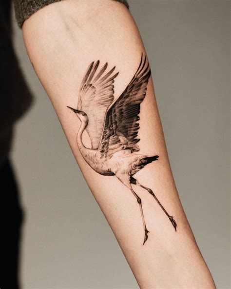 Micro-realistic style crane tattoo done on the inner