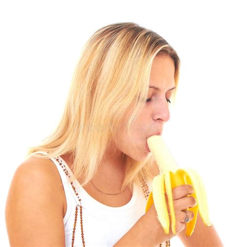 Young Woman Eating Peeled Banana Royalty Free Stock Image - Image: 17471616