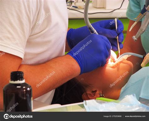 process  teeth treatment   young girl   dental clin