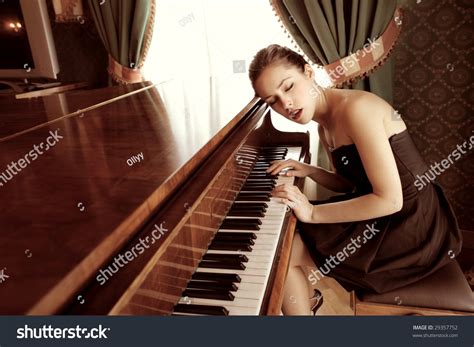 Beautiful Female Pianist Playing Piano Stock Photo 29357752 - Shutterstock