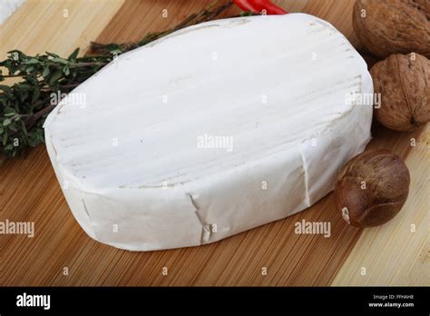 Brie cheese with thyme leaves and nuts Stock Photo - Alamy