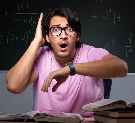Young Male Student Sitting in Classroom Stock Image - Image of late ...