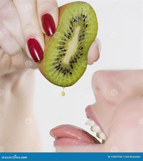 Woman Squeezing Kiwi into Mouth Stock Photo - Image of human