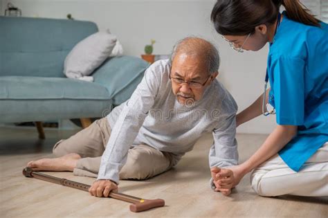 Asian Older Senior Man Falling Down on Lying Floor and Woman Nurse Came ...