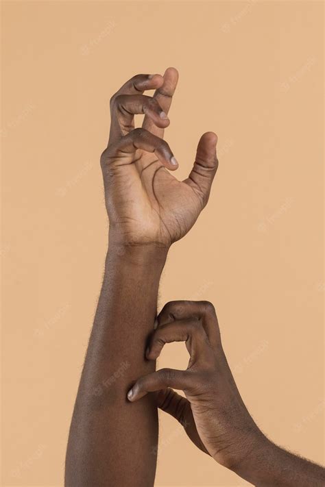 Free Photo | Front view hand scratching another hand