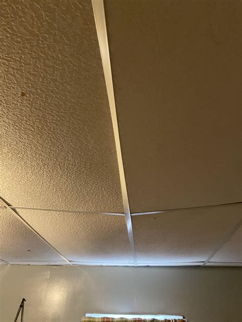 Drop ceiling wondering how to fix it sagging like this : r/HomeMaintenance