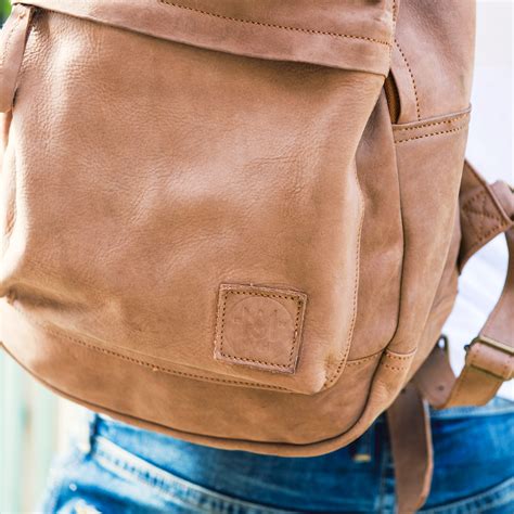 brown leather backpack pocket detail  man  holding  flickr