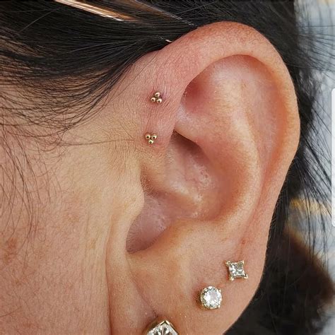 Simple and lovely double forward helix piercings by APP member Brian