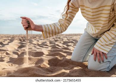 sand spilling womans hand beach stock photo  shutterstock