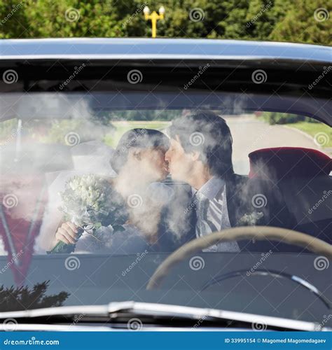 Couple kissing in car stock photo. Image of wedding, bride - 33995154