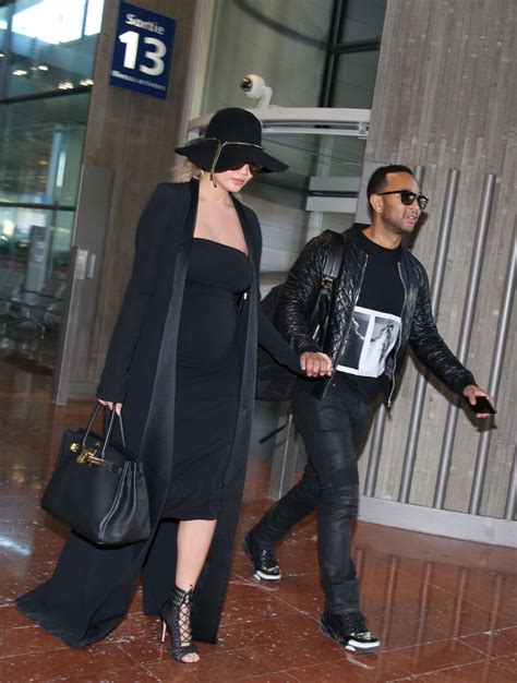 CHRISSY TEIGEN at Charles De Gaulle Airport in Paris 12/27/2015