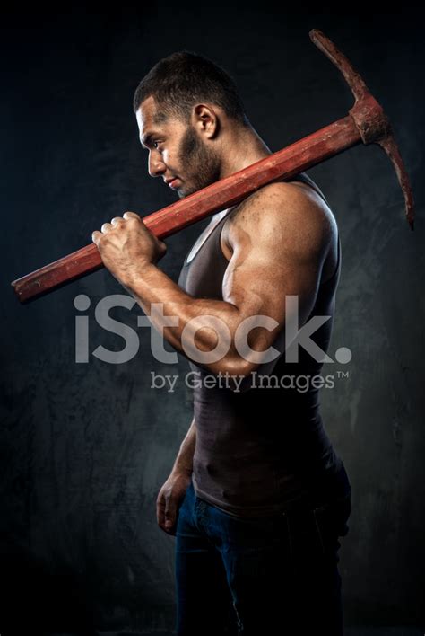 man holding pickaxe stock photo royalty  images freeimages