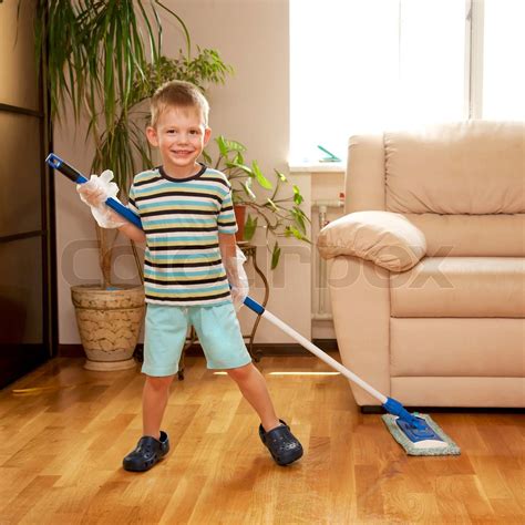 boy cleaning  apartment washing  floor stock image