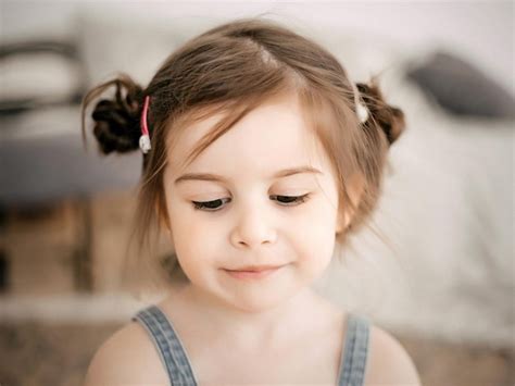 Premium Photo | Portrait of a funny little girl with beautiful eyes and ...