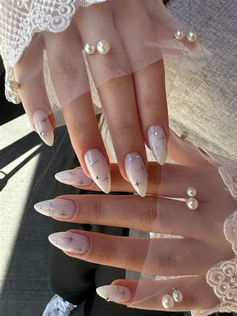 Milky white nails with stars and gems in 2025 | White nails, Classy ...