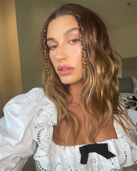 Hailey Bieber's Face-Framing Braids Encapsulate The '90s Aesthetic