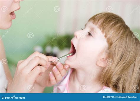Pediatrician Examining Little Girls Throat Stock Photography ...