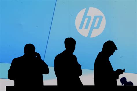 hewlett packard shakes  management raises outlook