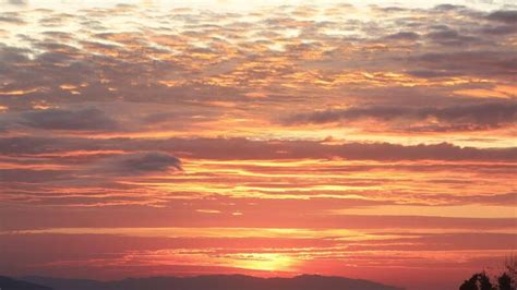 Time lapse of ray of sunlight shines behind the mountain top for nature design purpose 50472234 ...